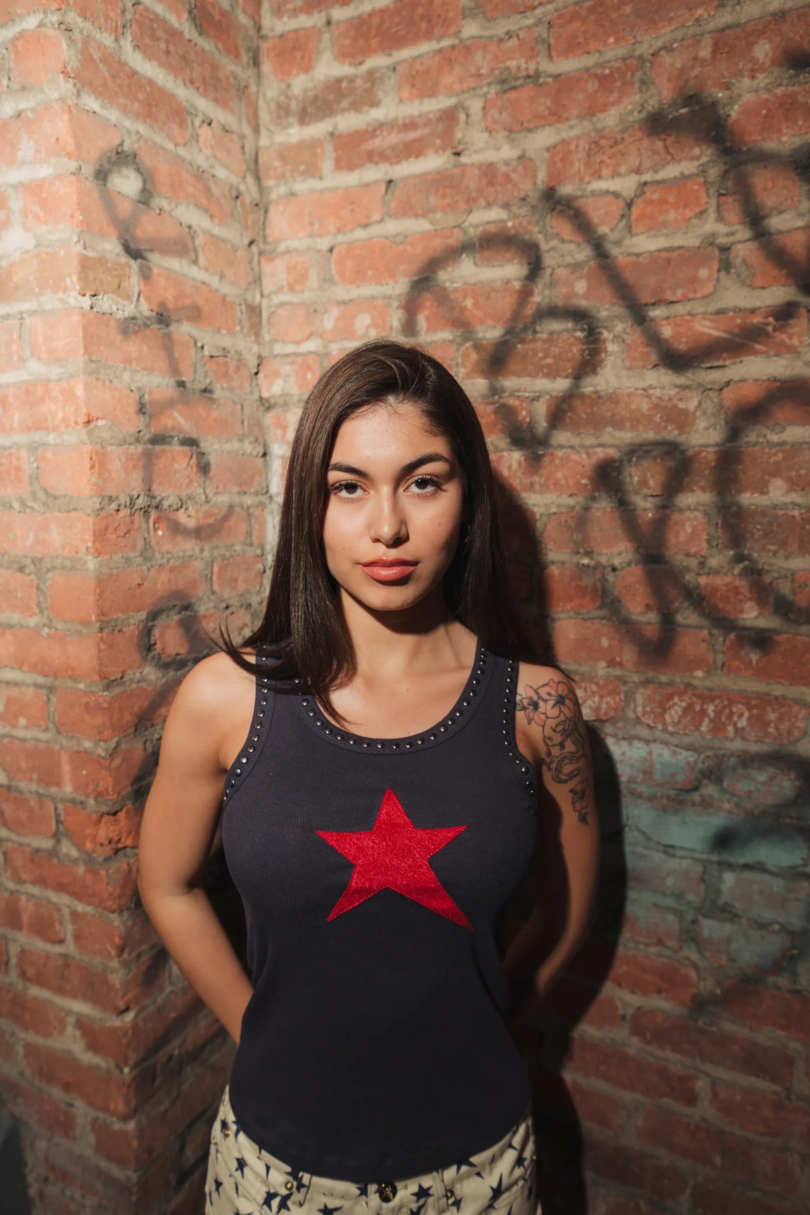 Star Tank — Navy w/ Red Star — hero — NYC brick wall — Andrew Charles SS26