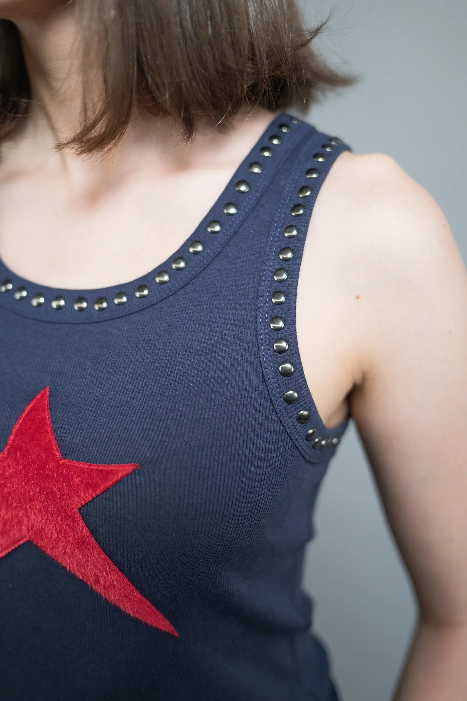 Star Tank — Navy w/ Red Star — studio angle — Andrew Charles SS26