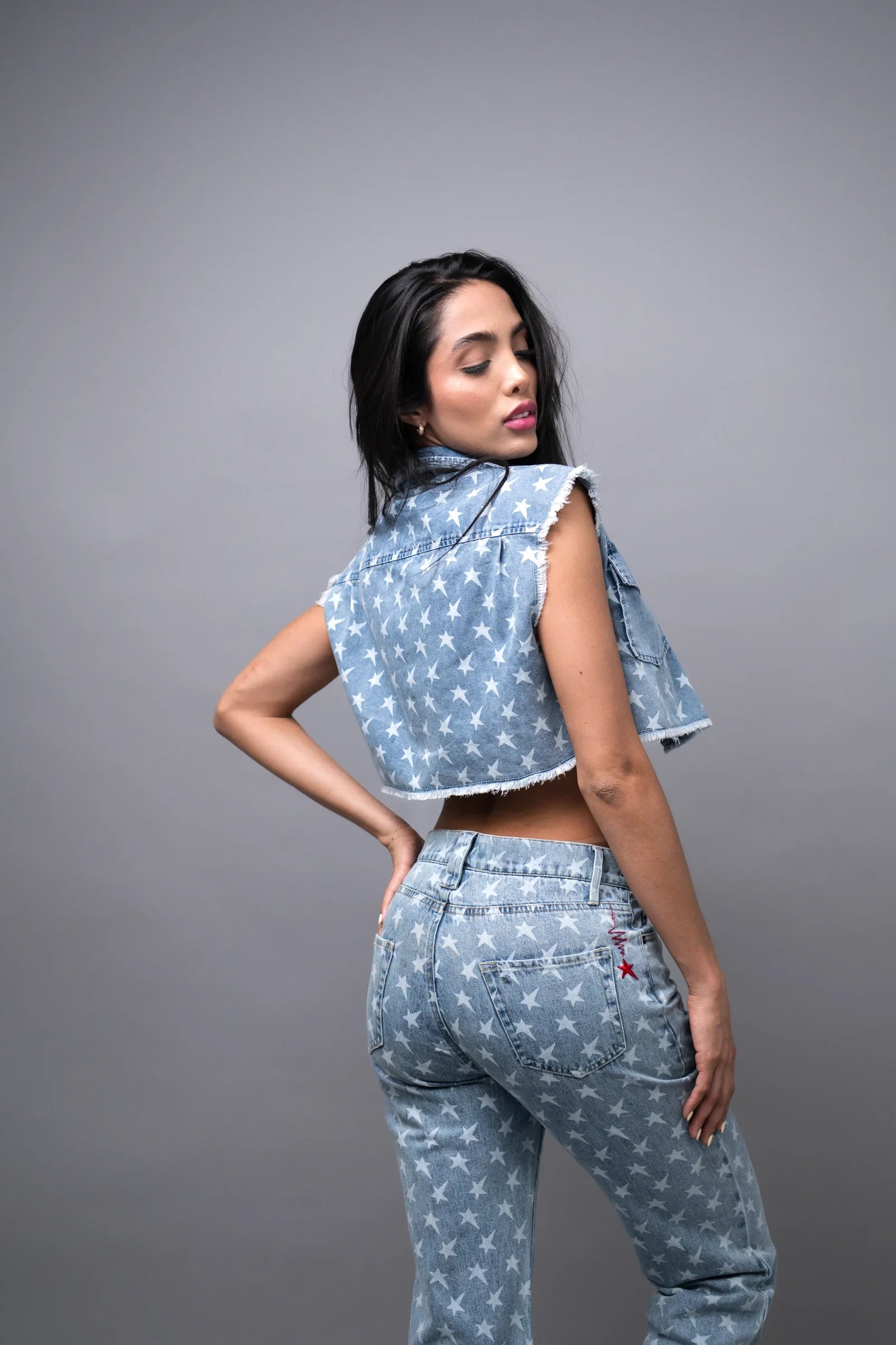 Star Print Denim Vest — Blue Wash — studio back view w/ star jeans — Andrew Charles SS26